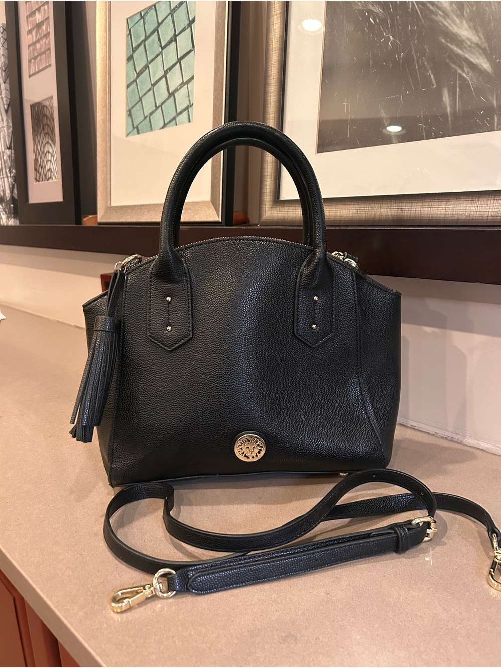 Structured Black Leather Top-Handle Satchel with Tassel Accent